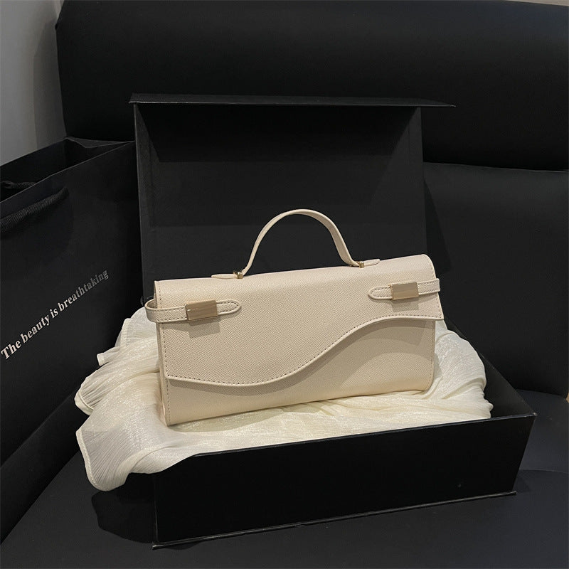 Structured Leather Shoulder Bag with Wave Flap and Gold Hardware