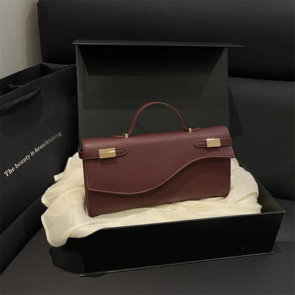 Structured Leather Shoulder Bag with Wave Flap and Gold Hardware